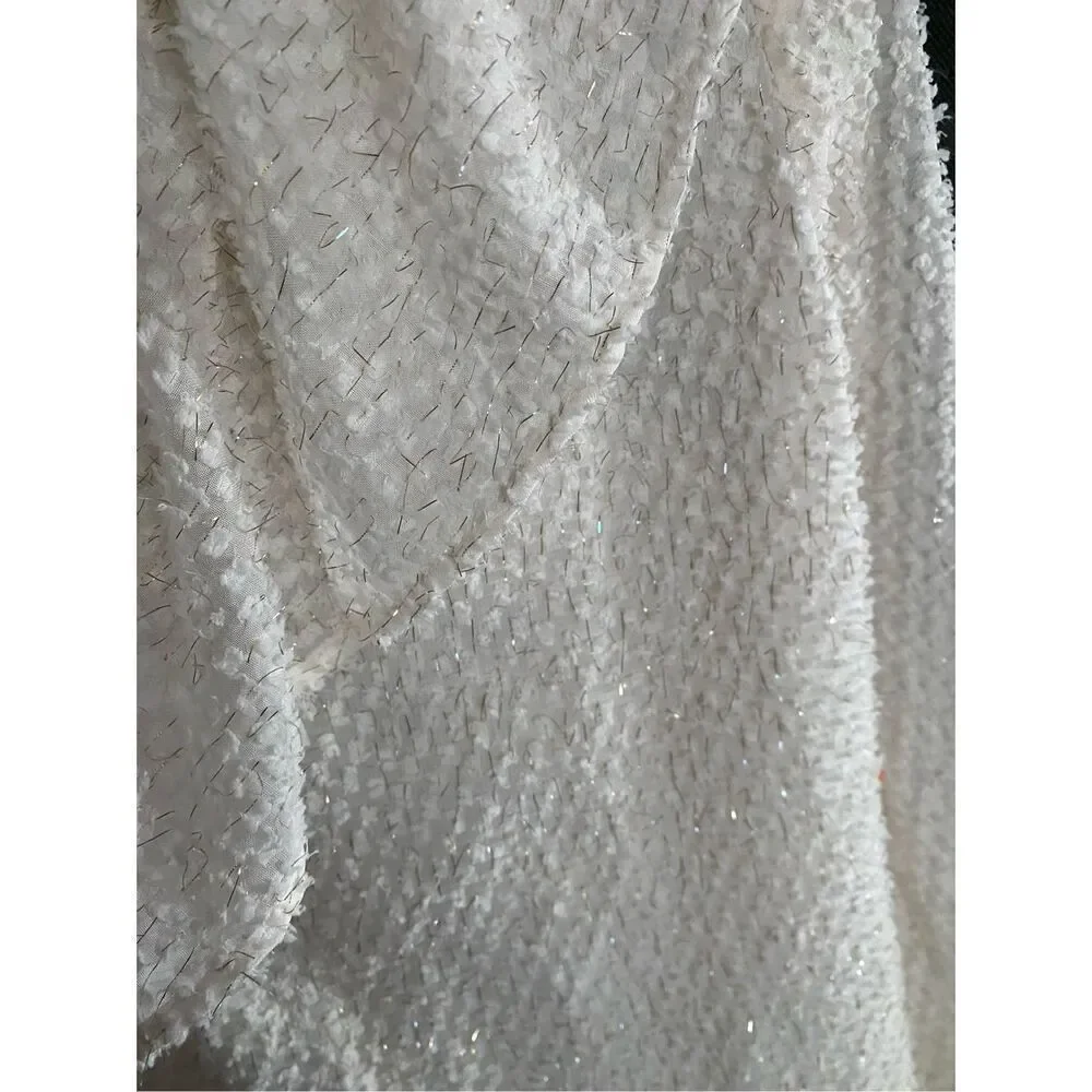 Loft white and gold shimmer ruffle Swiss.blouse size medium.￼